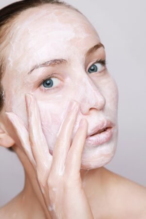 young, woman, natural, female, applying, applies, beauty, face, cream, lotion, on, skin, portrait, lifestyle, model, beautiful, skincare, treatment, cosmetics, skincare, skincare, skincare, skincare, skincare